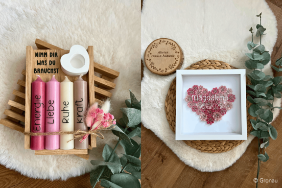 Zwei Deko‑Arrangements: links Holzkiste mit vier Kerzen (beschriftet Energie, Liebe, Ruhe, Kraft) und Schild „Nimm dir was du brauchst“; rechts gerahmtes Herz aus rosa Trockenblumen mit dem Namen „Magdalena“ und Datum.
